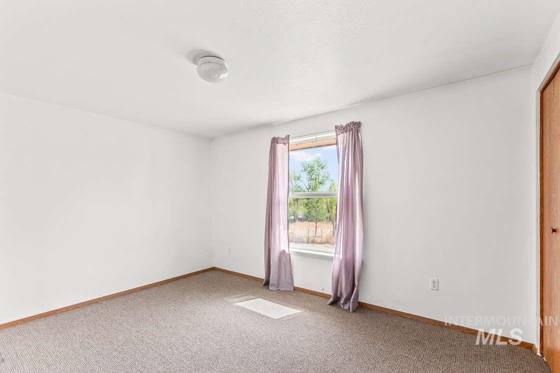 255 3 Bear Creek Road Kendrick, ID 83537 - Photo 24 of 44 Unfurnished room featuring carpet flooring and baseboards