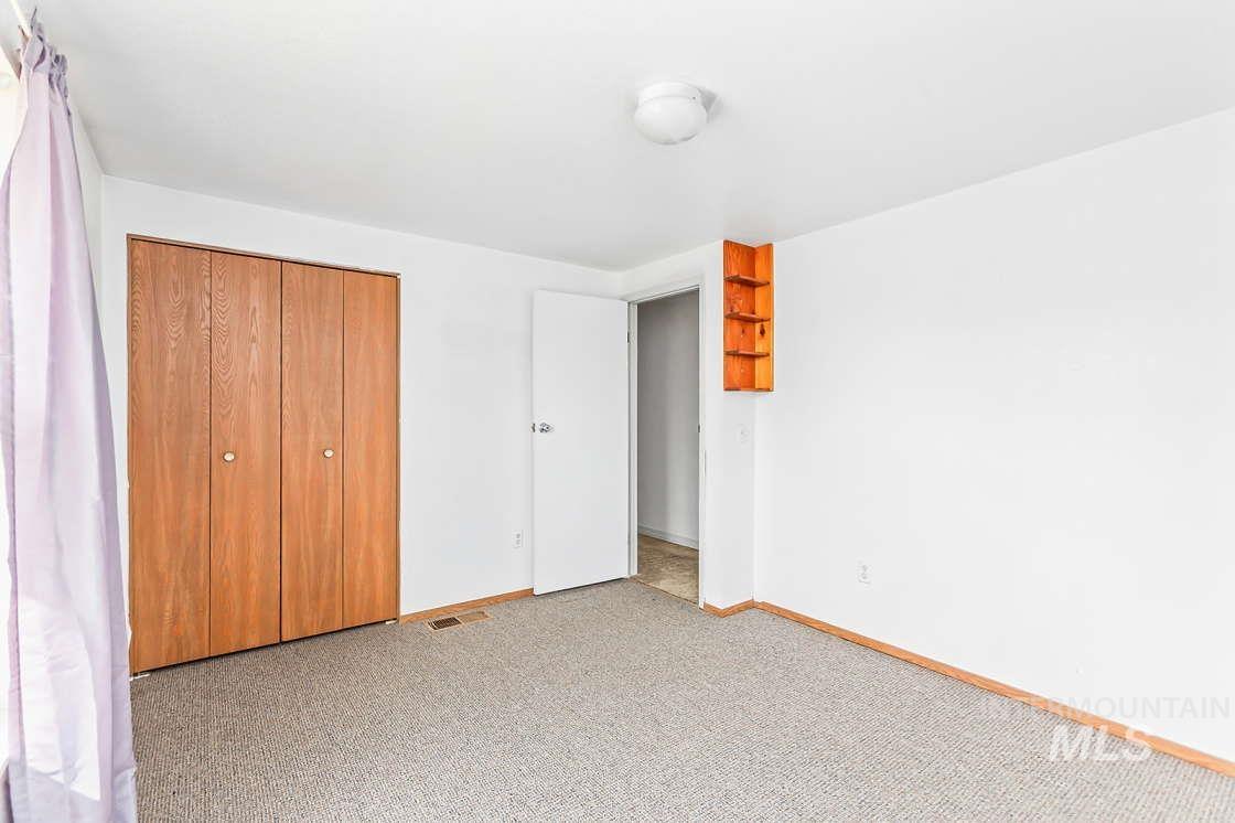 255 3 Bear Creek Road Kendrick, ID 83537 - Photo 25 of 44 Unfurnished bedroom with carpet and a closet