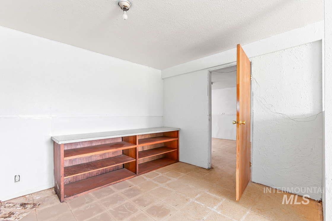 255 3 Bear Creek Road Kendrick, ID 83537 - Photo 42 of 44 Corridor with a textured ceiling