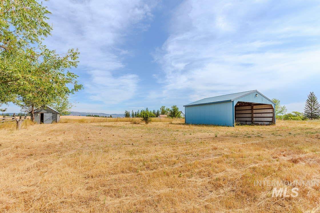 255 3 Bear Creek Road Kendrick, ID 83537 - Photo 5 of 44 View of grassy yard with an outbuilding, a pole building, and a rural view