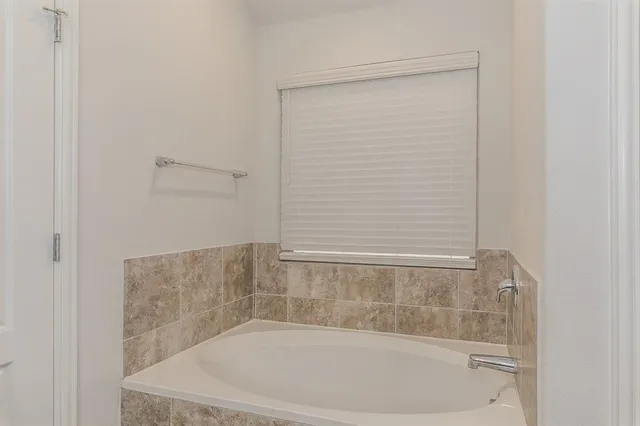 a bathroom with a double vanity sink mirror and double