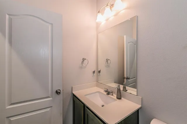 a bedroom with baby bed toys and a baby crib