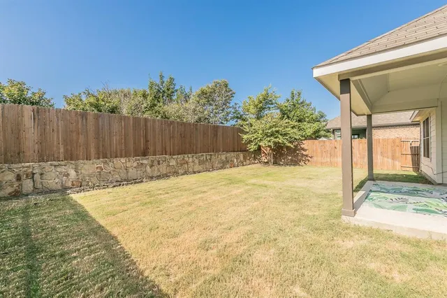 a swimming pool with an outdoor space and seating area
