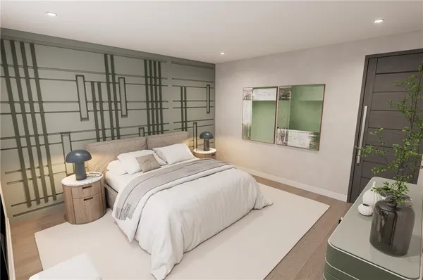 a bedroom with a bed and a mirror
