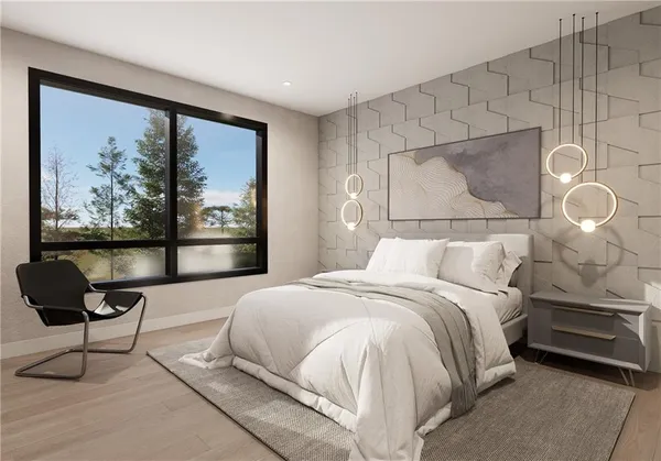 a bedroom with a bed and a painting on the wall