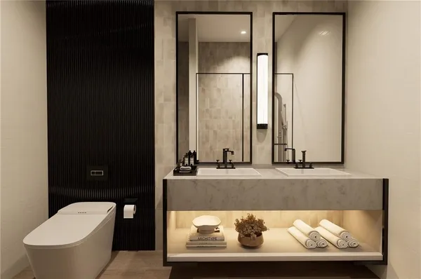 a bathroom with a toilet and a sink