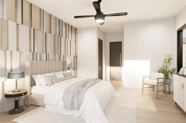 a bedroom with furniture and a large window