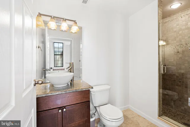 a bathroom with a shower and a toilet