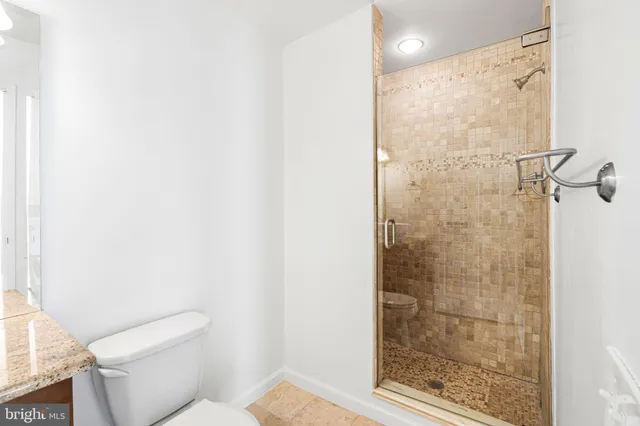a kitchen with granite countertop a sink and potted plant
