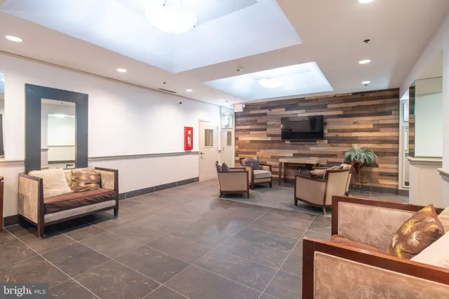 a view of a swimming pool with outdoor seating