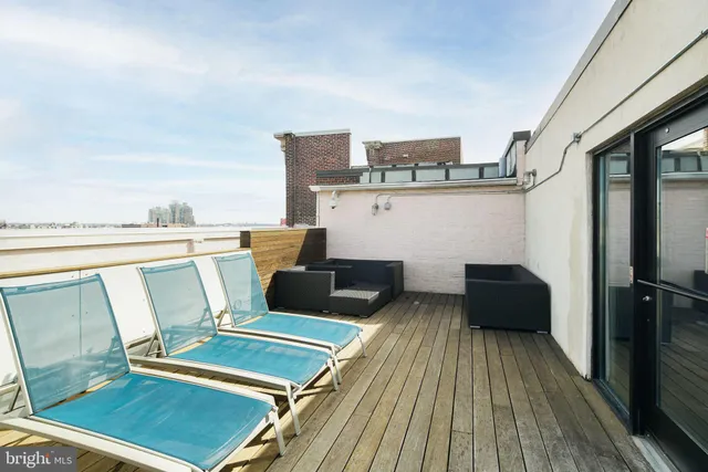 a view of a terrace with furniture