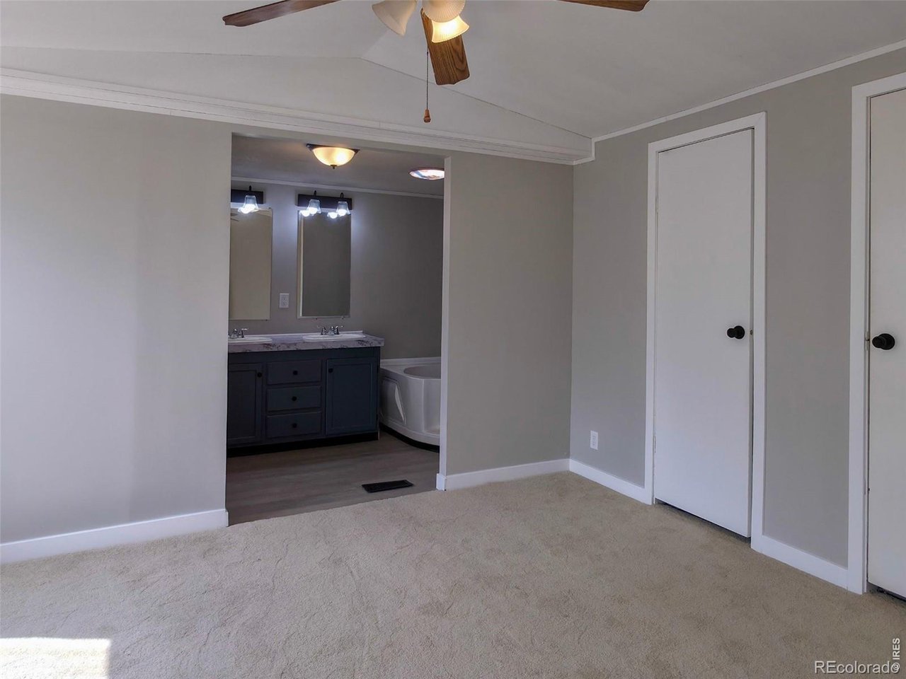 1401 9th Street, Unit 80 Fort Lupton, CO 80621 - Photo 14 of 21 a view of an empty room with a fireplace