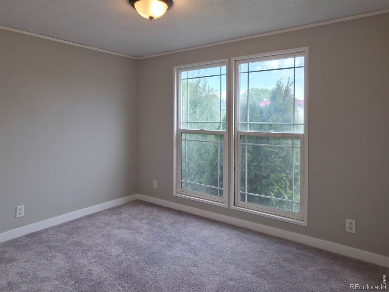 1401 9th Street, Unit 80 Fort Lupton, CO 80621 - Photo 20 of 21 an empty room with a window
