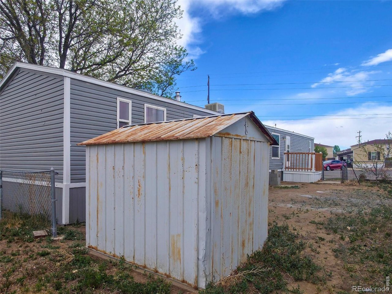 1401 9th Street, Unit 80 Fort Lupton, CO 80621 - Photo 21 of 21 a backyard of a house