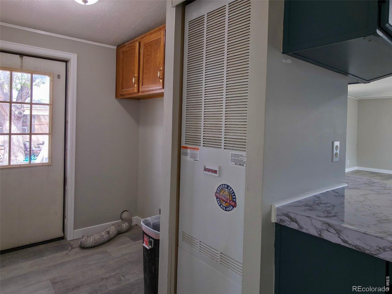1401 9th Street, Unit 80 Fort Lupton, CO 80621 - Photo 8 of 21 a room with storage and utility