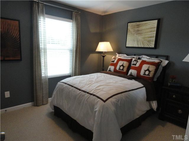 4400 Hargrove Road Raleigh, NC 27604 - Photo 10 of 10 a bed sitting in a bedroom next to a window