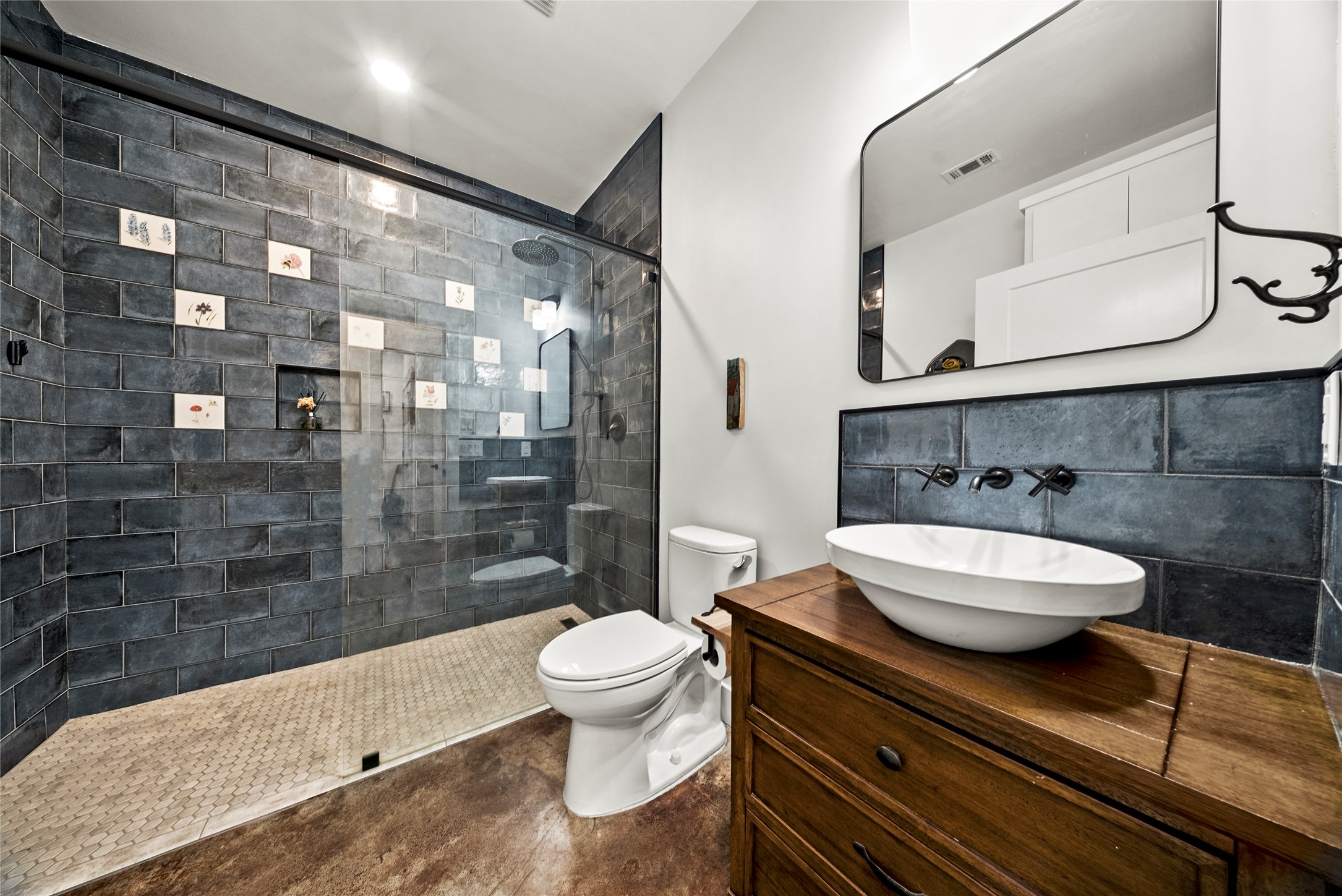 153 County Road 491 Elgin, TX 78621 - Photo 24 of 40 a bathroom with a granite countertop sink a toilet a mirror and shower
