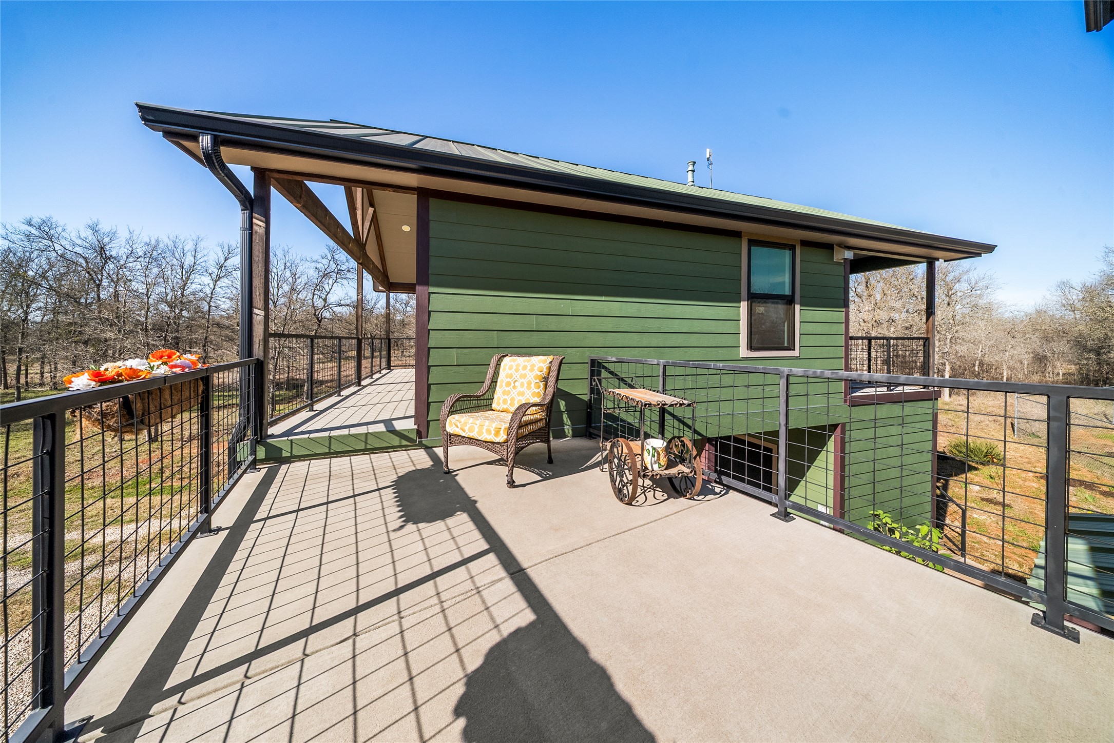153 County Road 491 Elgin, TX 78621 - Photo 27 of 40 a view of a balcony with chairs and wooden floor