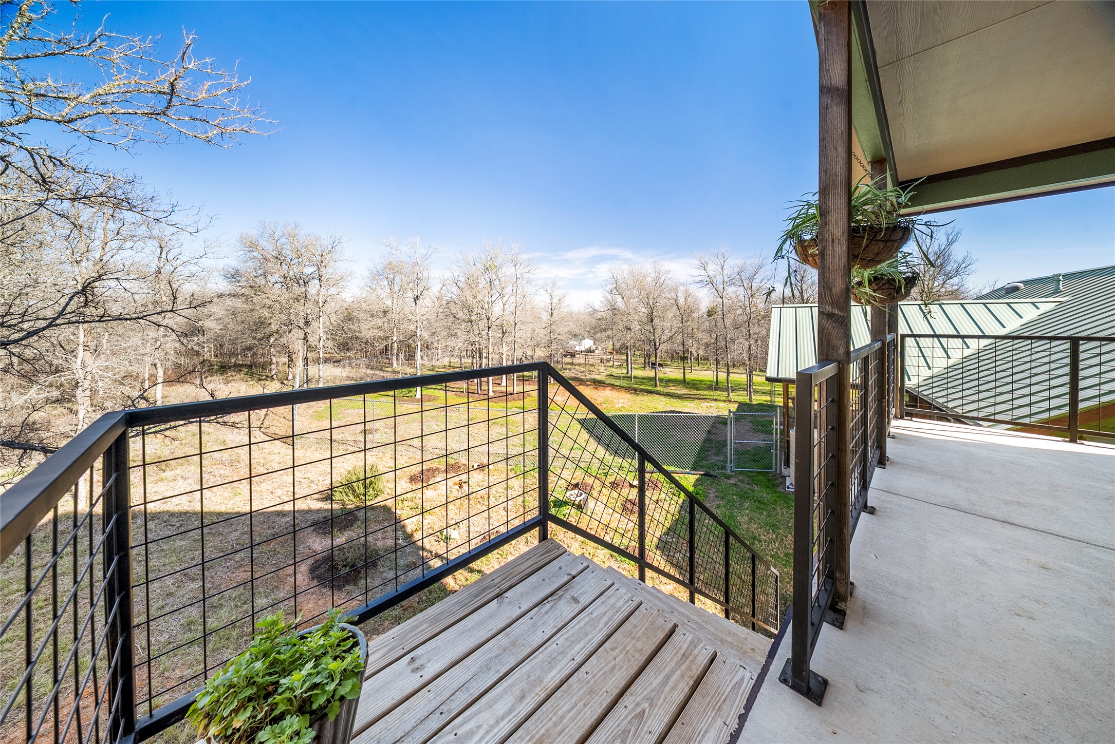153 County Road 491 Elgin, TX 78621 - Photo 28 of 40 a view of balcony with wooden floor and fence