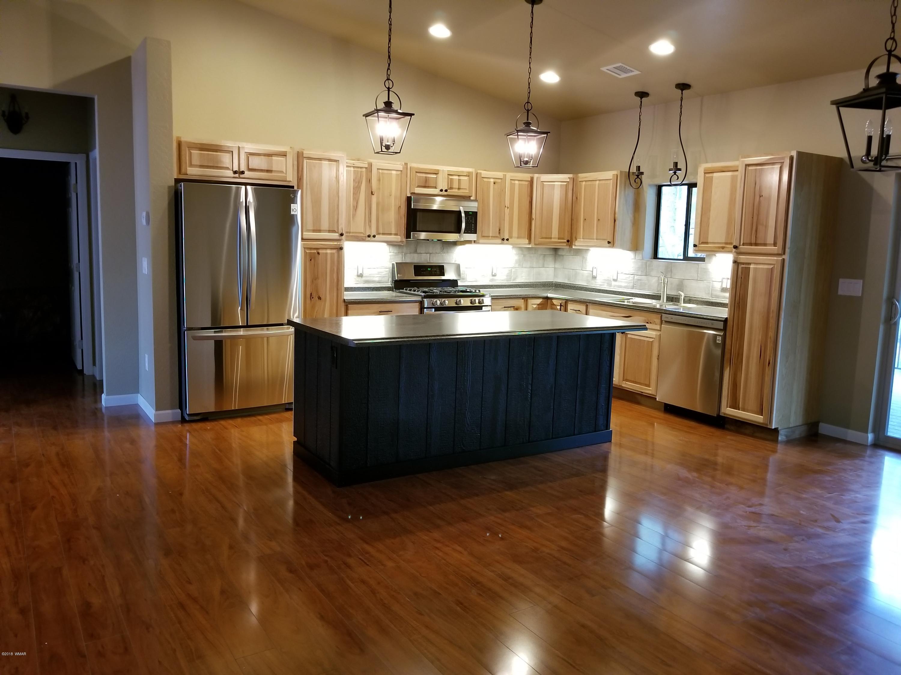 2962 Chestnut Circle, Unit 3 Pinetop, AZ 85935 - Photo 17 of 35 a kitchen with stainless steel appliances granite countertop a refrigerator a sink and a stove