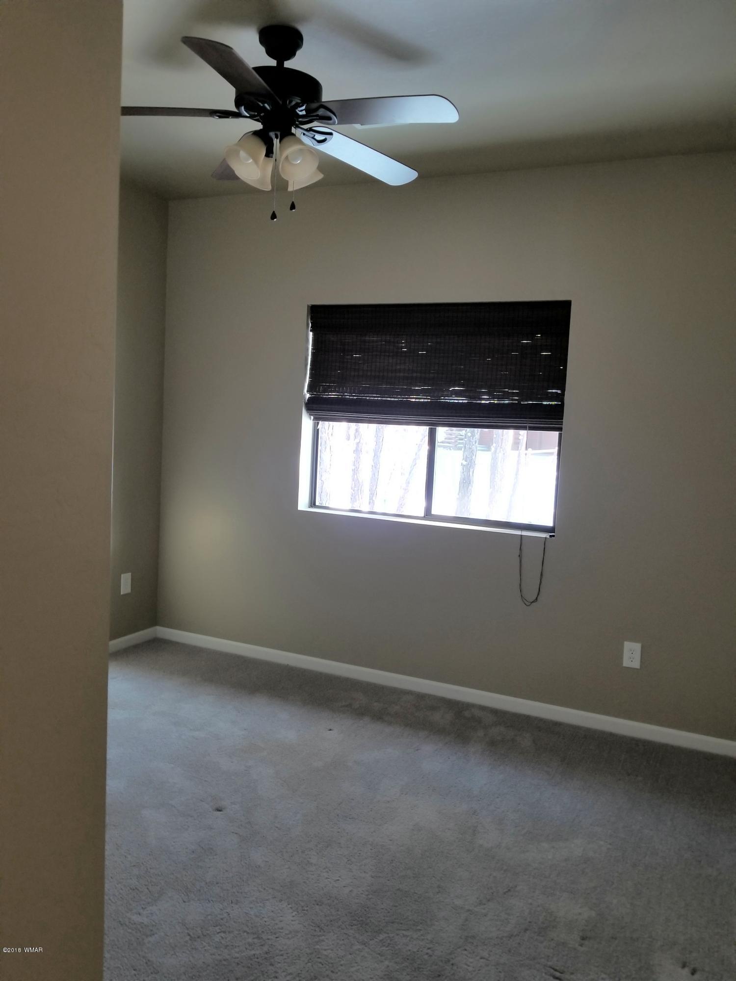 2962 Chestnut Circle, Unit 3 Pinetop, AZ 85935 - Photo 20 of 35 a view of a livingroom with a ceiling fan and window