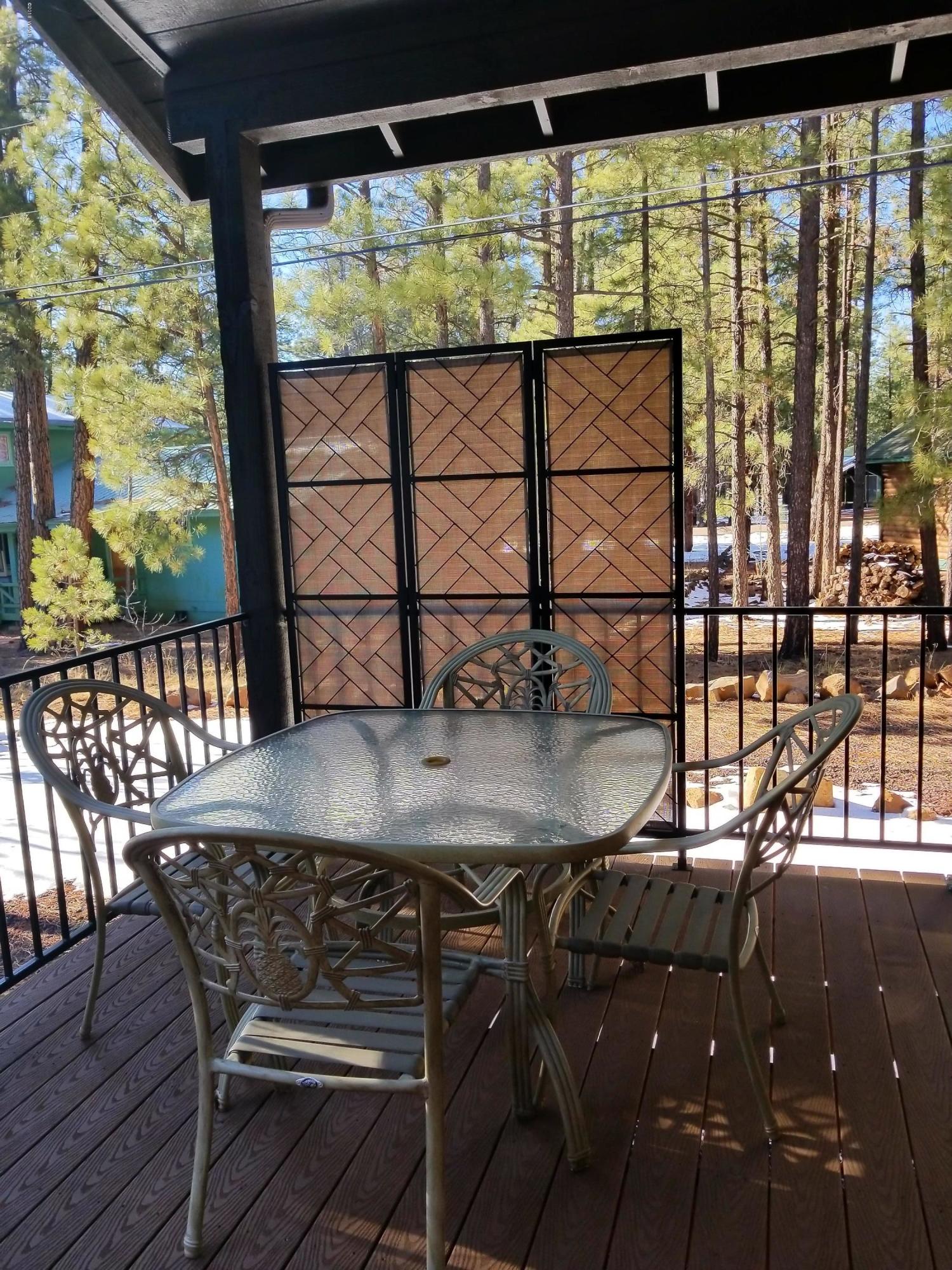 2962 Chestnut Circle, Unit 3 Pinetop, AZ 85935 - Photo 31 of 35 a view of a chairs and table in the balcony