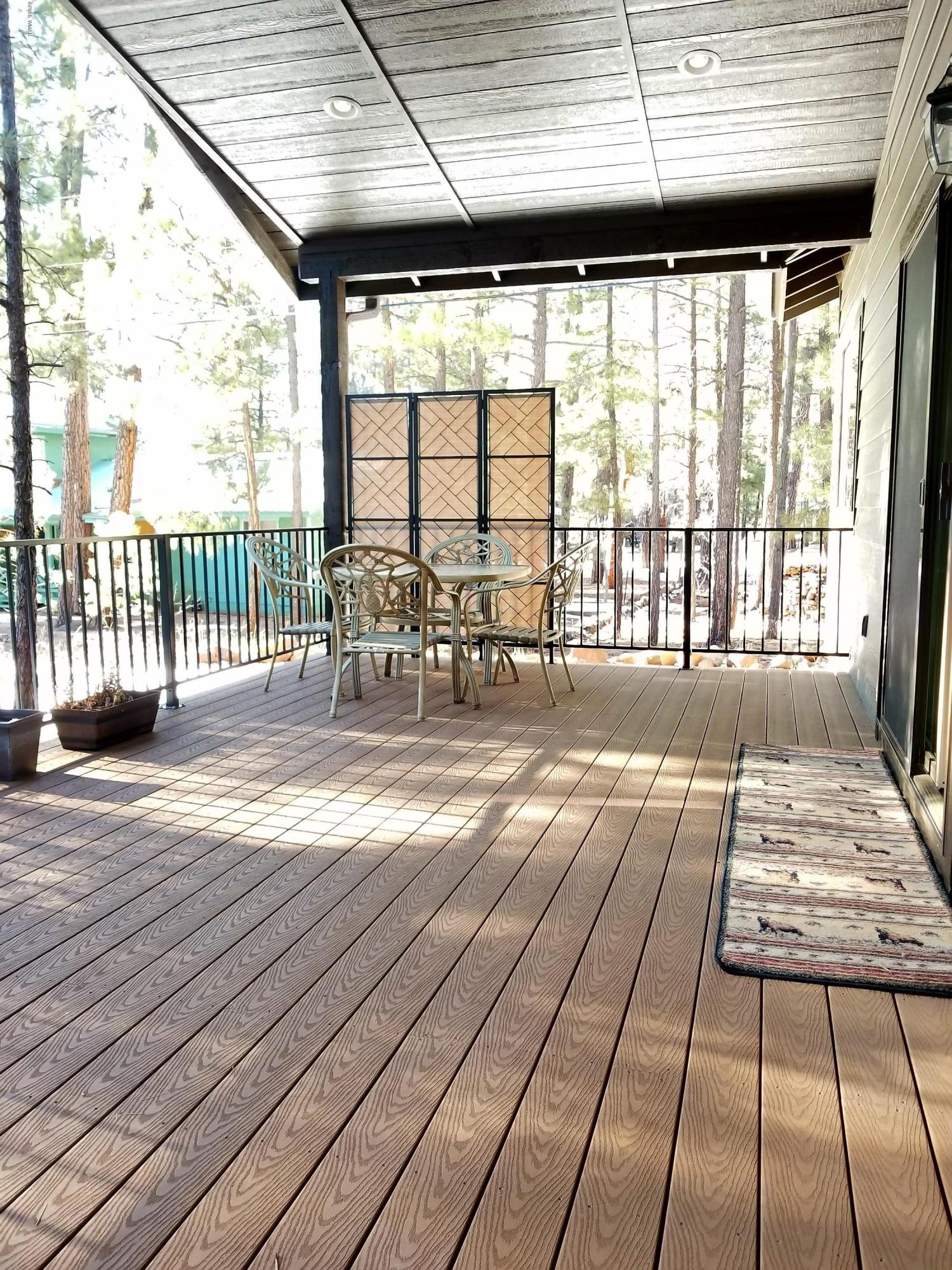 2962 Chestnut Circle, Unit 3 Pinetop, AZ 85935 - Photo 32 of 35 a view of empty room with wooden floor and furniture