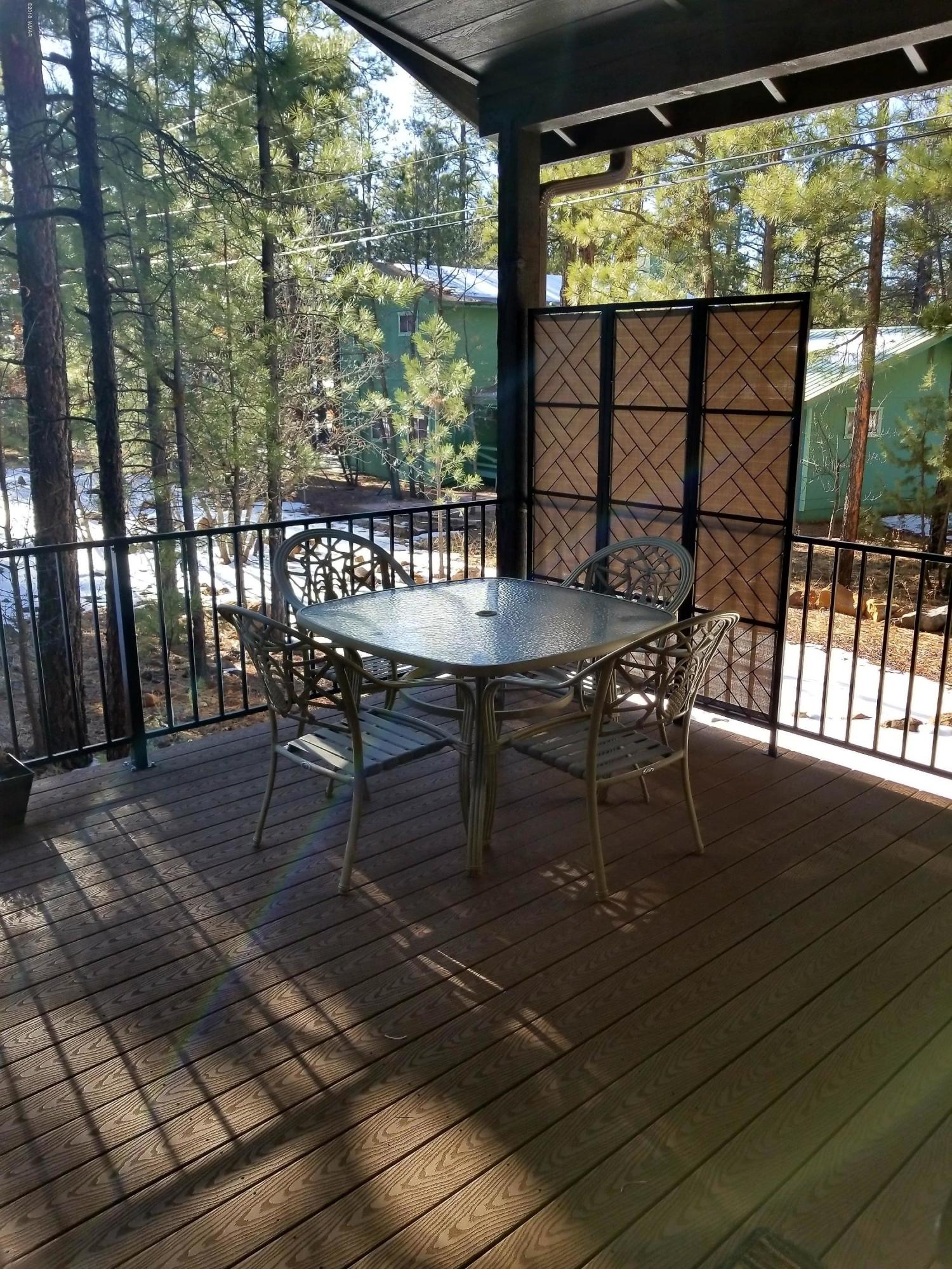 2962 Chestnut Circle, Unit 3 Pinetop, AZ 85935 - Photo 33 of 35 a view of a porch with furniture and wooden floor