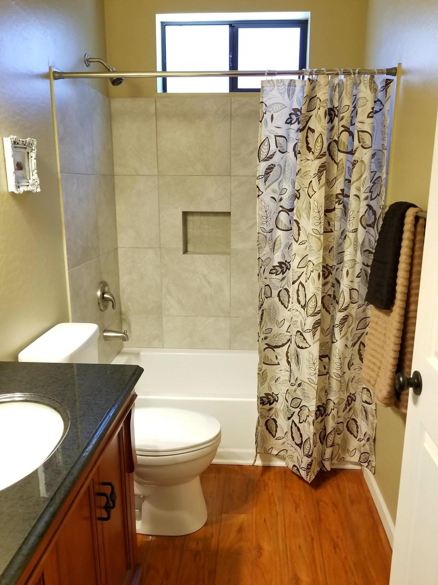 2962 Chestnut Circle, Unit 3 Pinetop, AZ 85935 - Photo 34 of 35 a bathroom with a sink toilet and shower