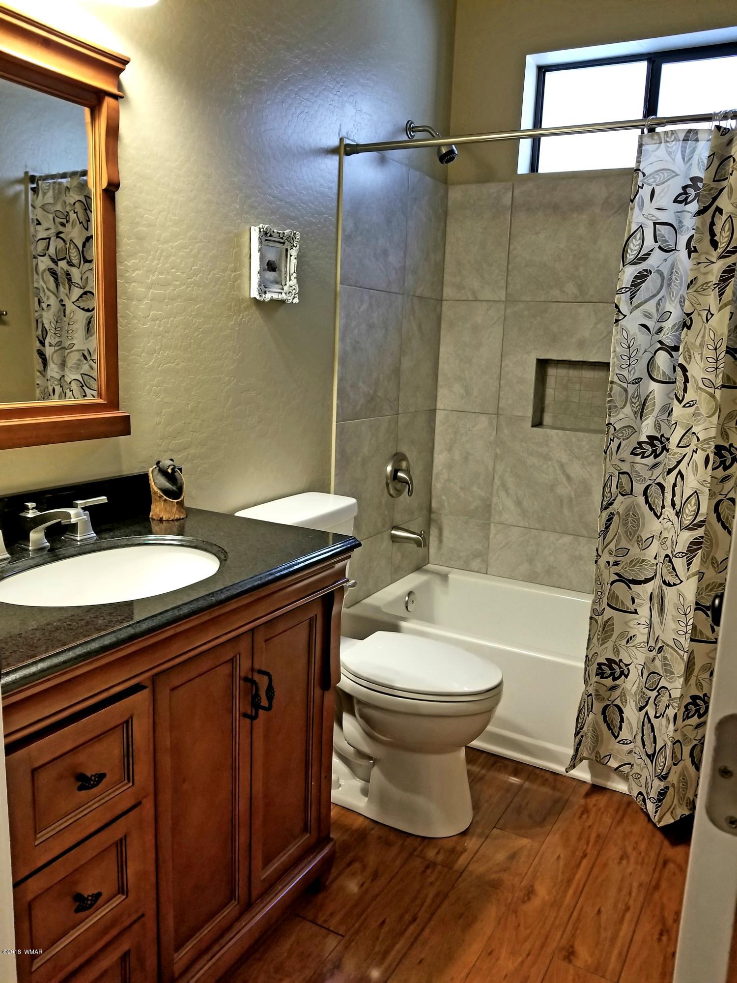 2962 Chestnut Circle, Unit 3 Pinetop, AZ 85935 - Photo 35 of 35 a bathroom with a sink and a mirror