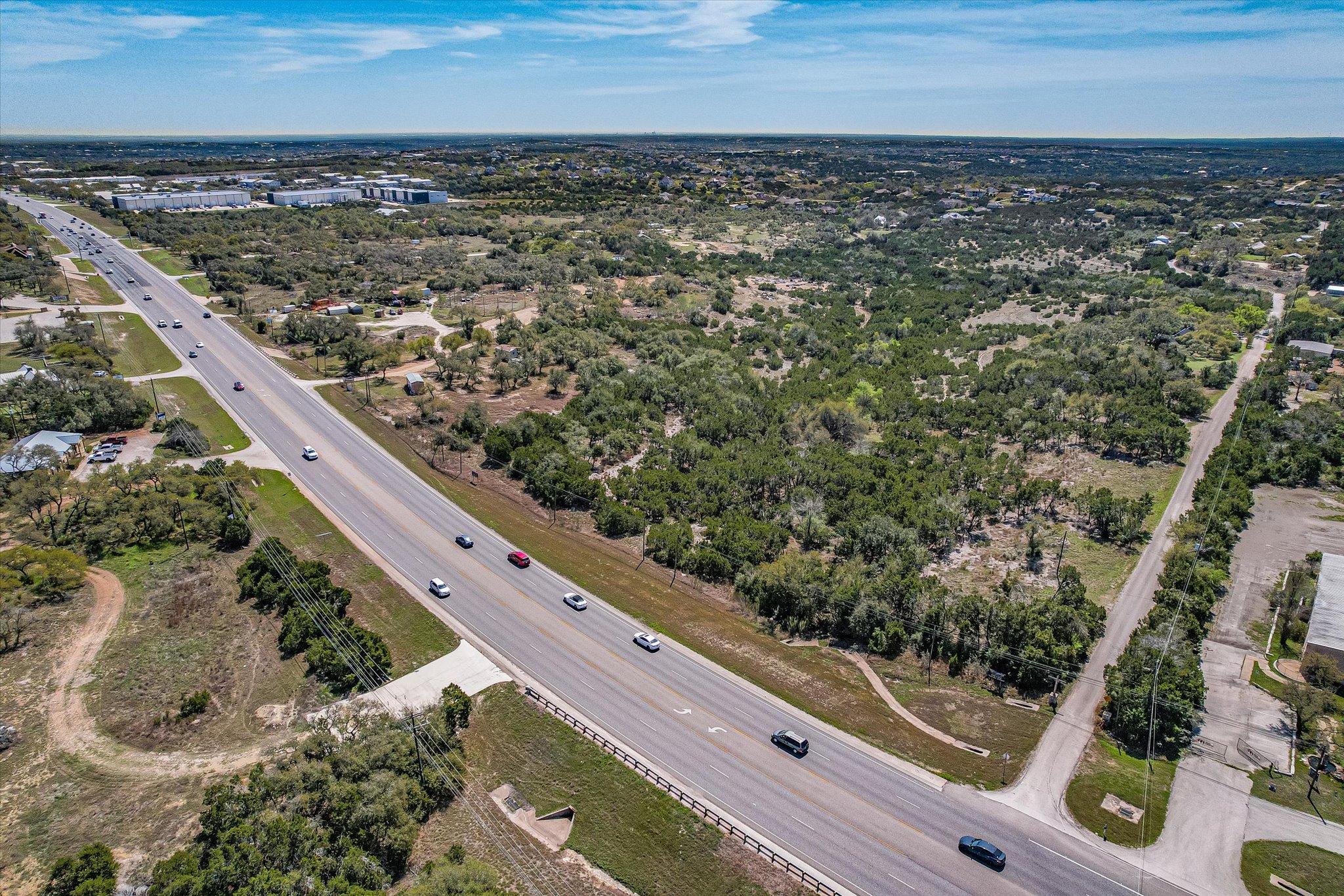 411 Whitetail Ridge Austin, TX 78737 - Photo 37 of 38 Drone / aerial view of a tree filled landscape