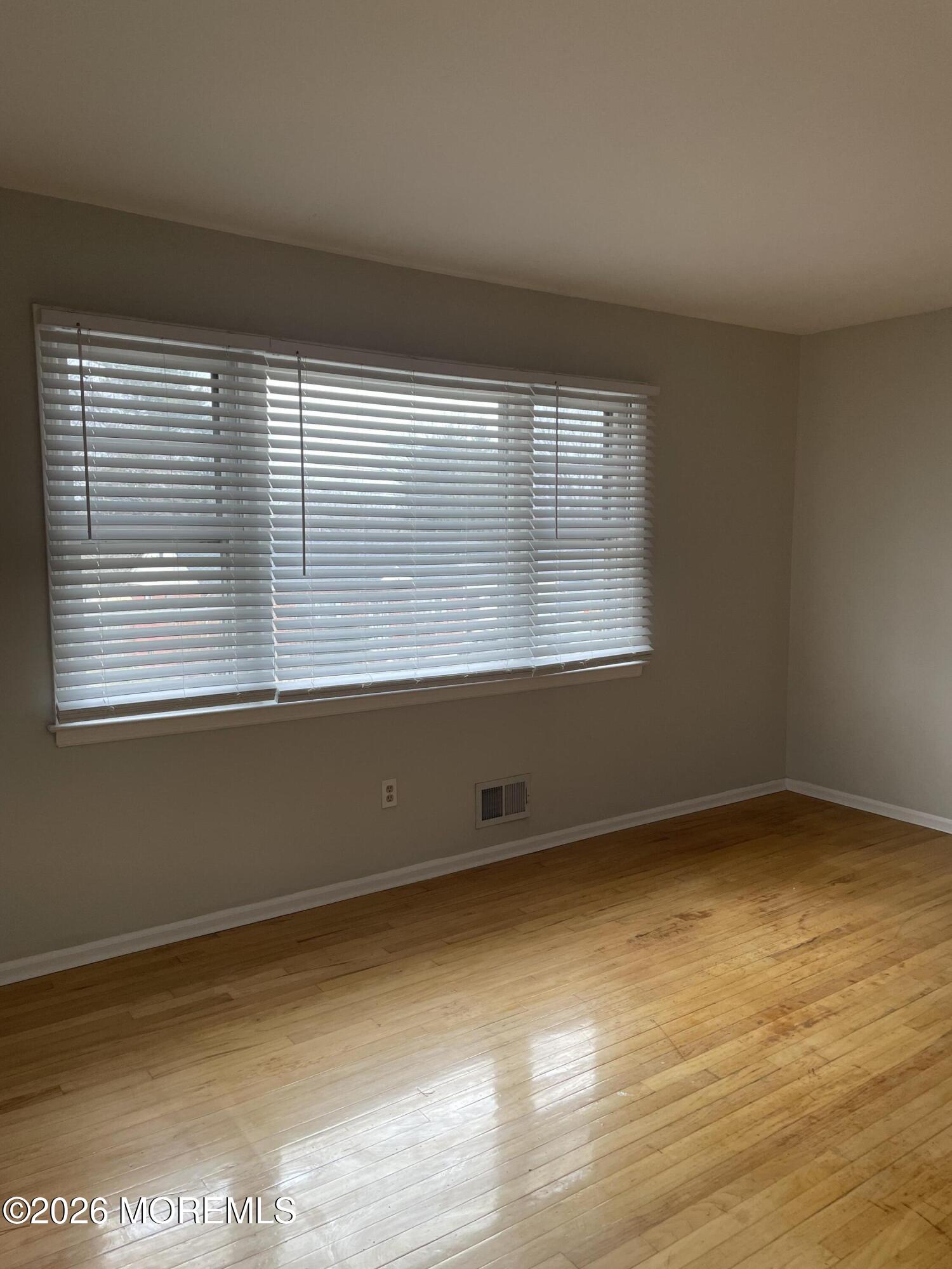 13 Johnson Avenue, Unit 2 Matawan, NJ 07747 - Photo 7 of 10 an empty room with a window