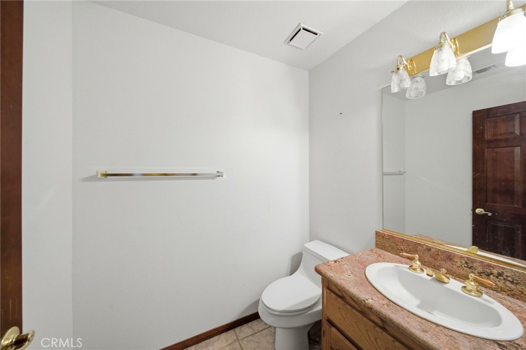 19670 Tonkawan Road Apple Valley, CA 92307 - Photo 45 of 70 Half Bath off the Kitchen