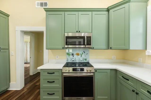 a kitchen with a stove and a sink