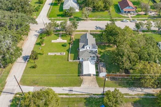 an aerial view of residential houses with outdoor space