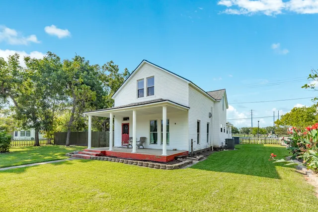 a view of a house with a yard patio and a patio