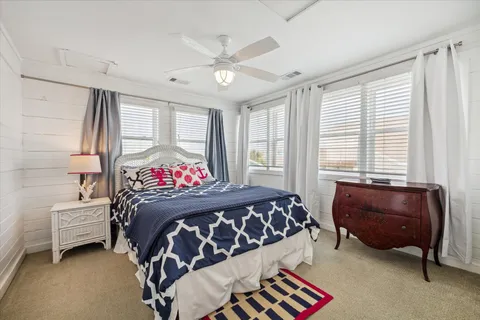 a bedroom with a bed and a couch