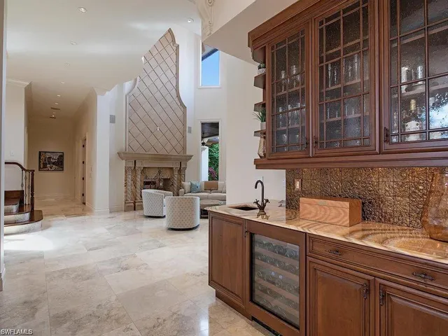 a kitchen with a sink cabinets and appliances