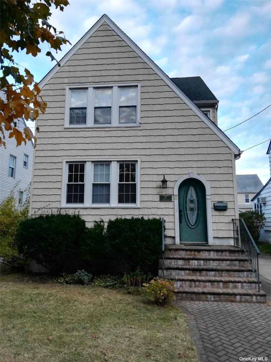 37 Fremont Road Valley Stream, NY 11581 - Photo 1 of 1 a front view of a house with a garden