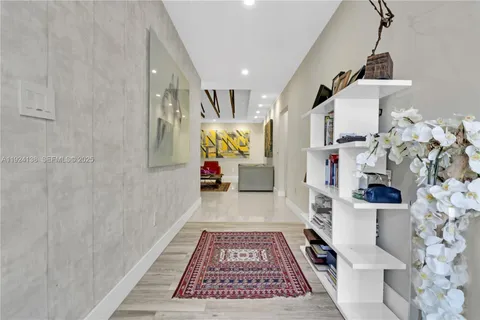 a hallway with a white stove top oven and rug