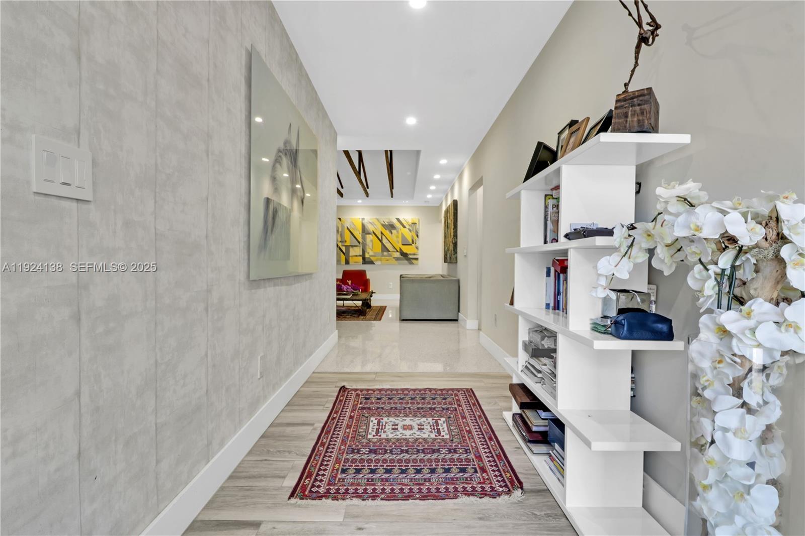 9008 Dickens Avenue Surfside, FL 33154 - Photo 18 of 29 a hallway with a white stove top oven and rug