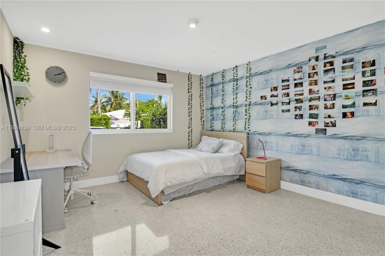 9008 Dickens Avenue Surfside, FL 33154 - Photo 22 of 29 a bedroom with a bed and a window