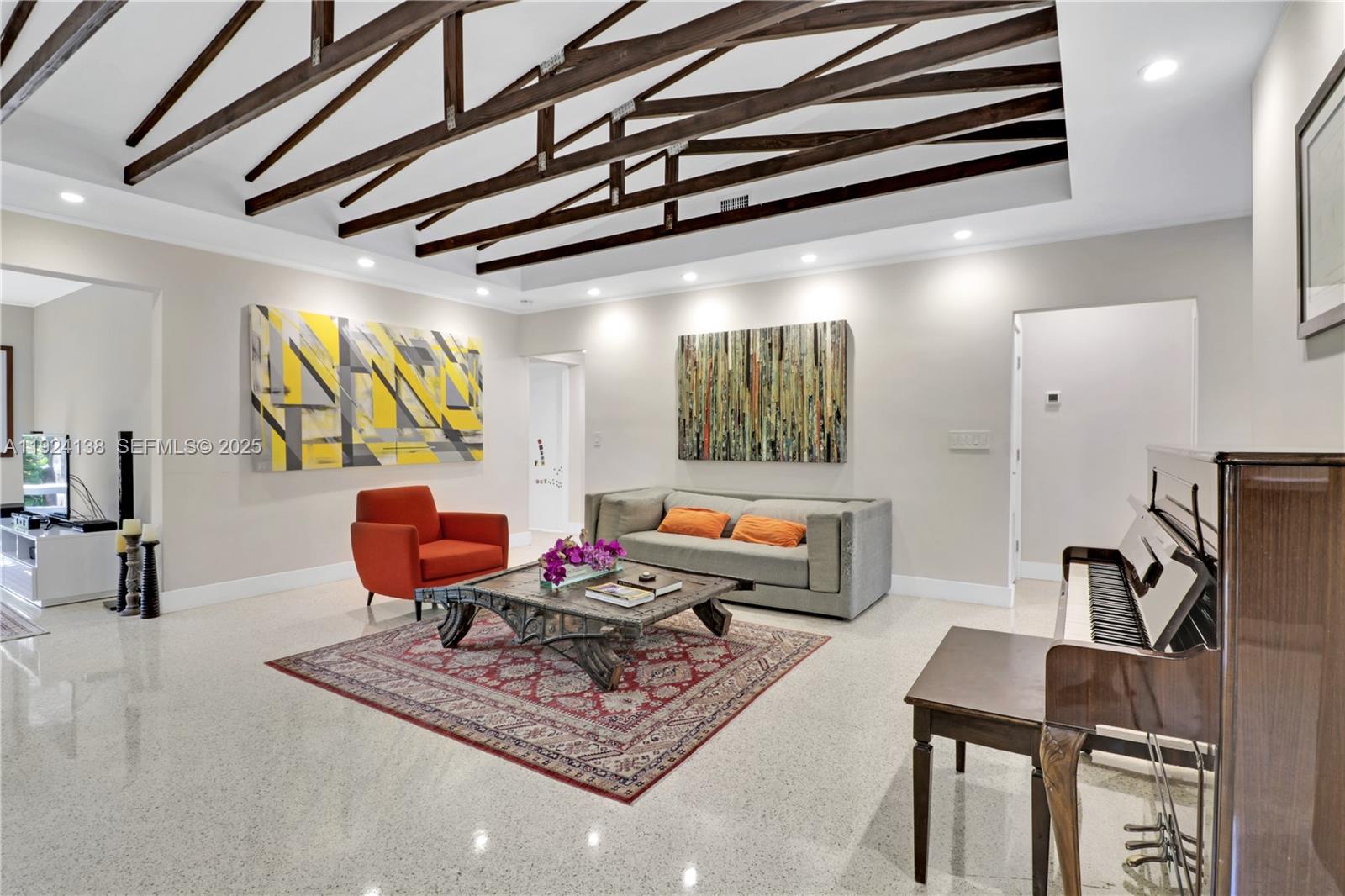 9008 Dickens Avenue Surfside, FL 33154 - Photo 4 of 29 a living room with furniture a rug and a window