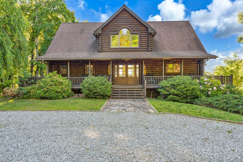 160 Outback Road Ferguson, NC 28624 - Photo 2 of 49 a front view of a house with garden
