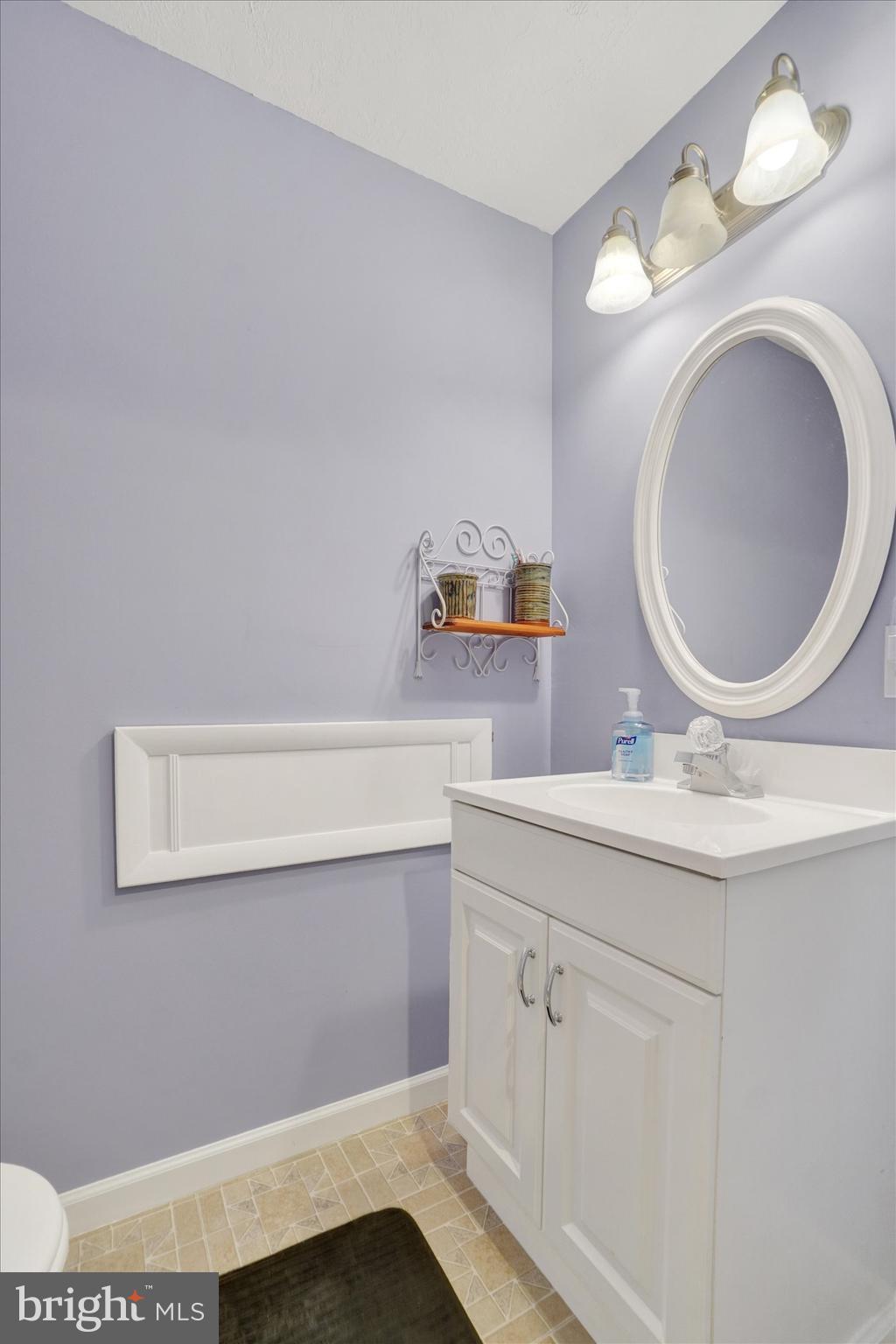335 Sechrist Flat Road Felton, PA 17322 - Photo 19 of 28 a bathroom with a sink a mirror and vanity