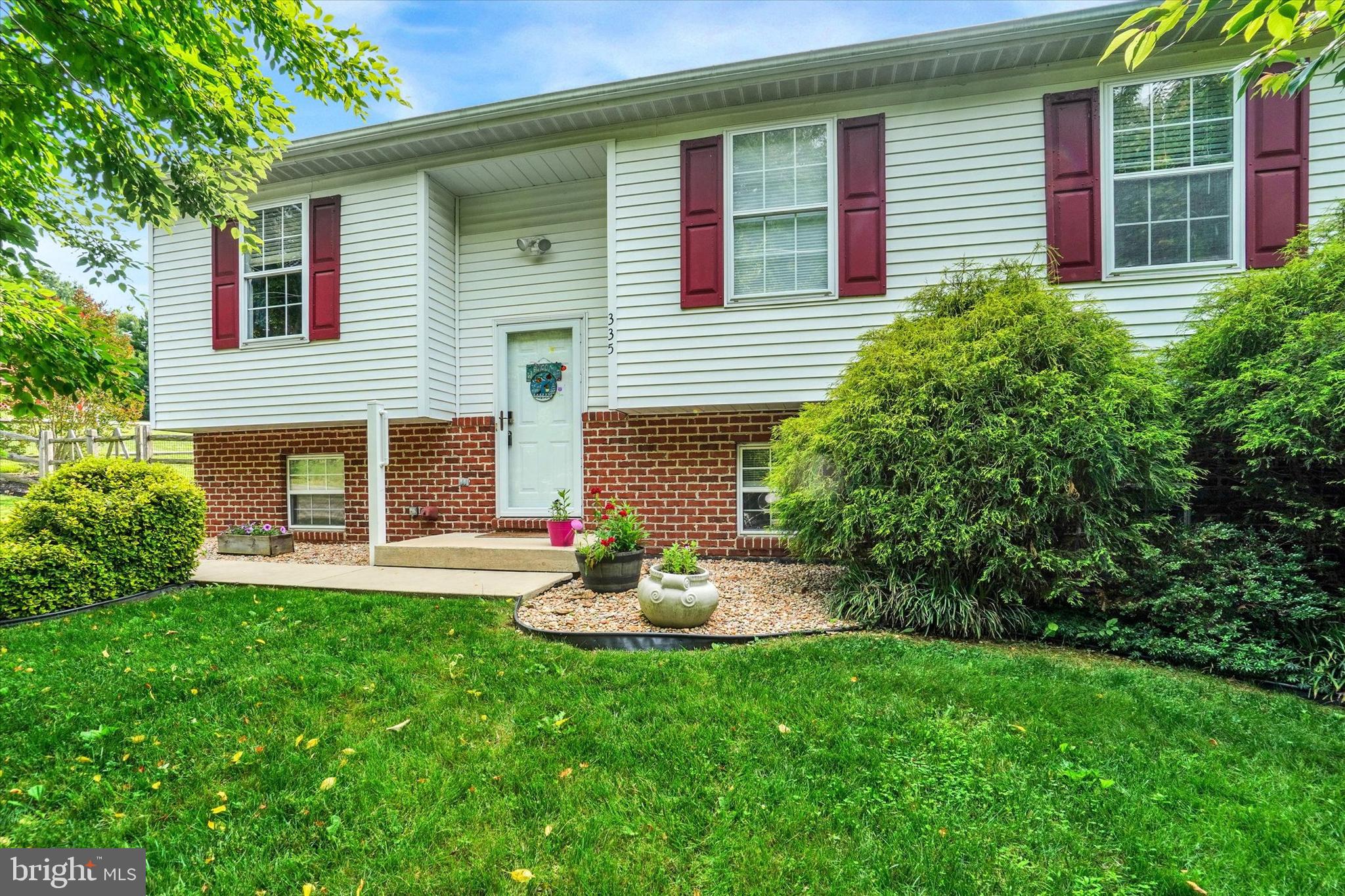 335 Sechrist Flat Road Felton, PA 17322 - Photo 3 of 28 a front view of a house with a yard and garage
