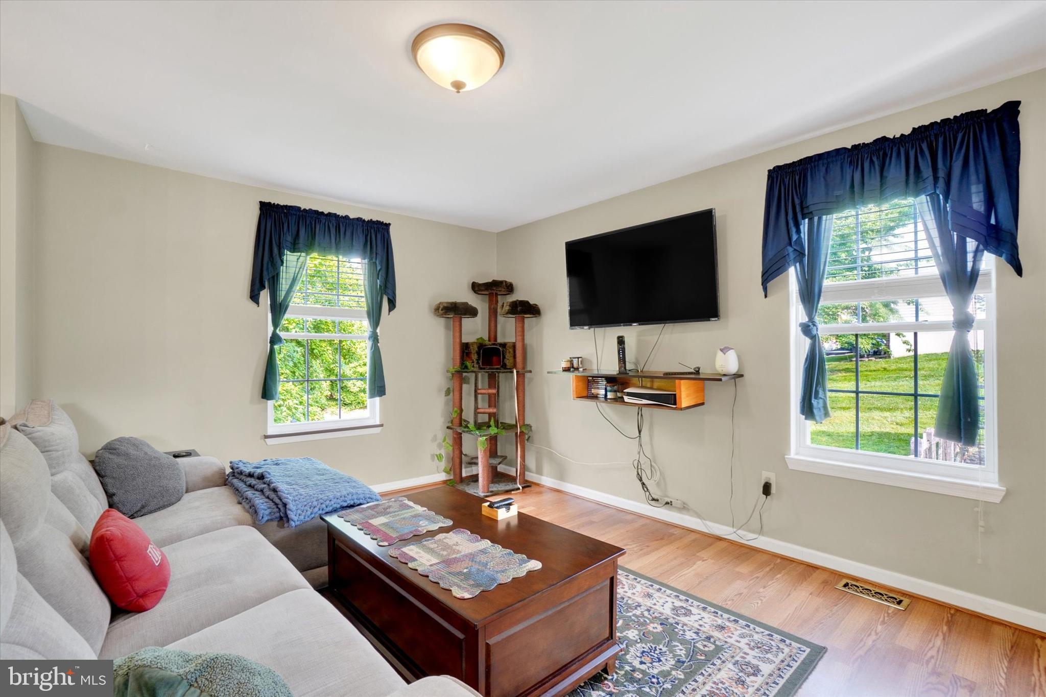 335 Sechrist Flat Road Felton, PA 17322 - Photo 5 of 28 a living room with furniture and a flat screen tv