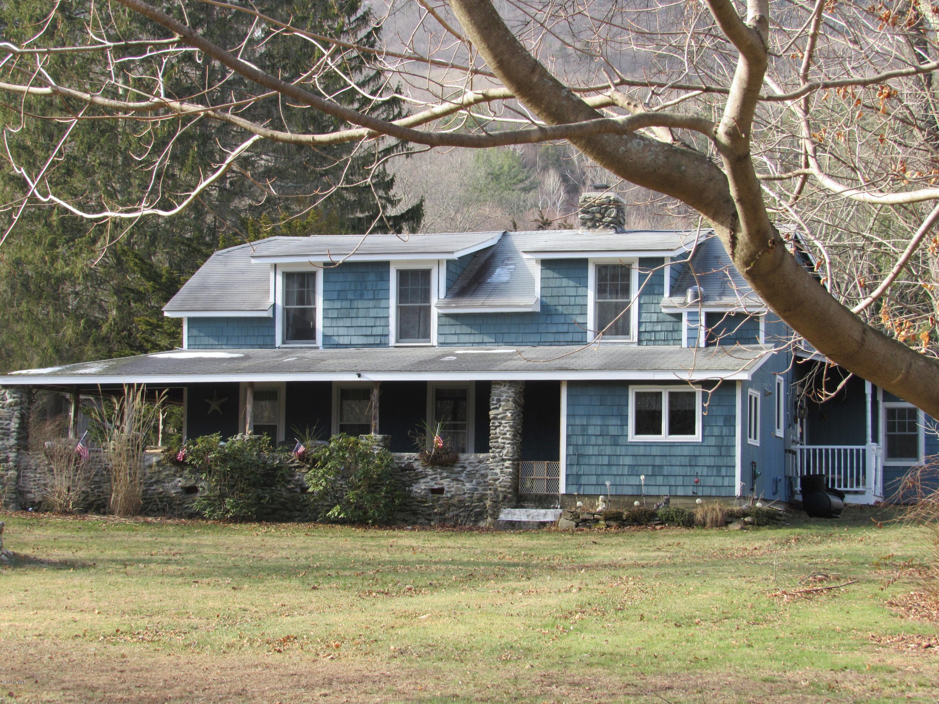 906 South Undermountain Road Sheffield, MA 01257 - Photo 1 of 12 a front view of a house with a garden