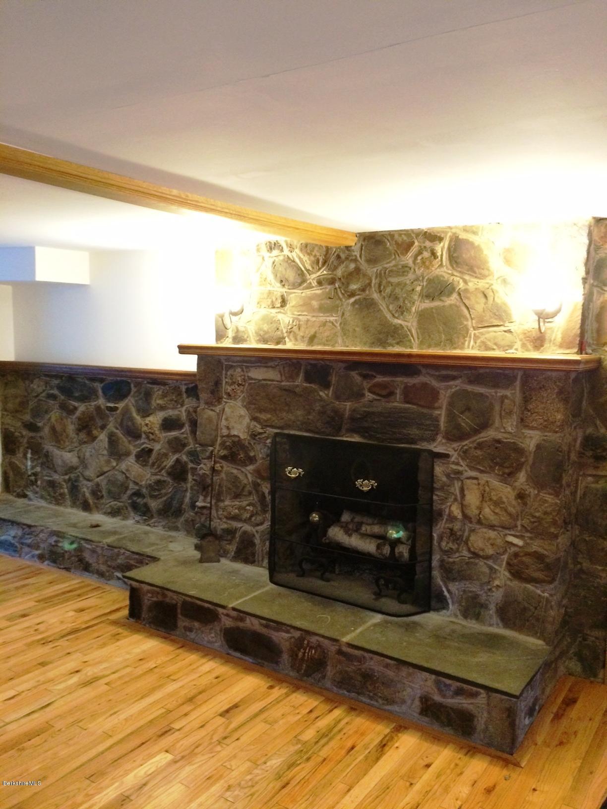 906 South Undermountain Road Sheffield, MA 01257 - Photo 4 of 12 a view of wooden floor and a fireplace