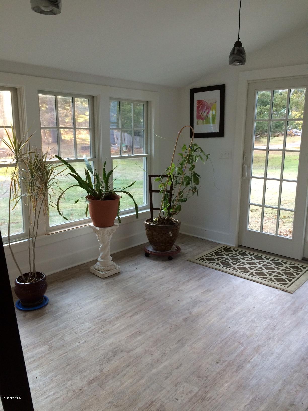 906 South Undermountain Road Sheffield, MA 01257 - Photo 5 of 12 a living room with furniture and a potted plant